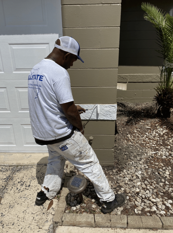 Allstate Painter Hand Rolling Trim On A Residential Painting Project