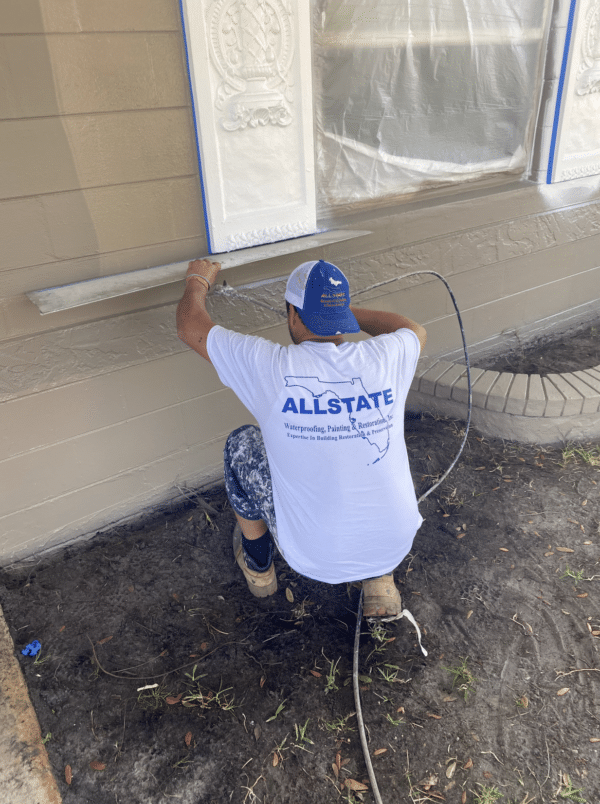 Allstate Painter Working On Details On A Residential Painting Project