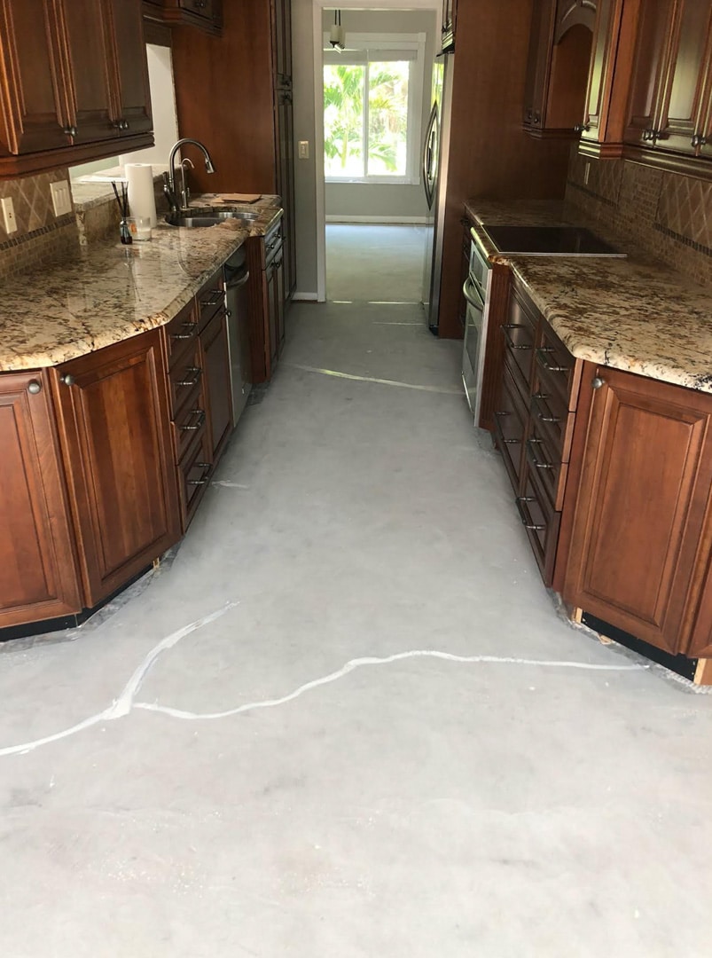 Kitchen Cracks In Slab Filled Before Waterproofing In Residence In Safety Harbor Florida
