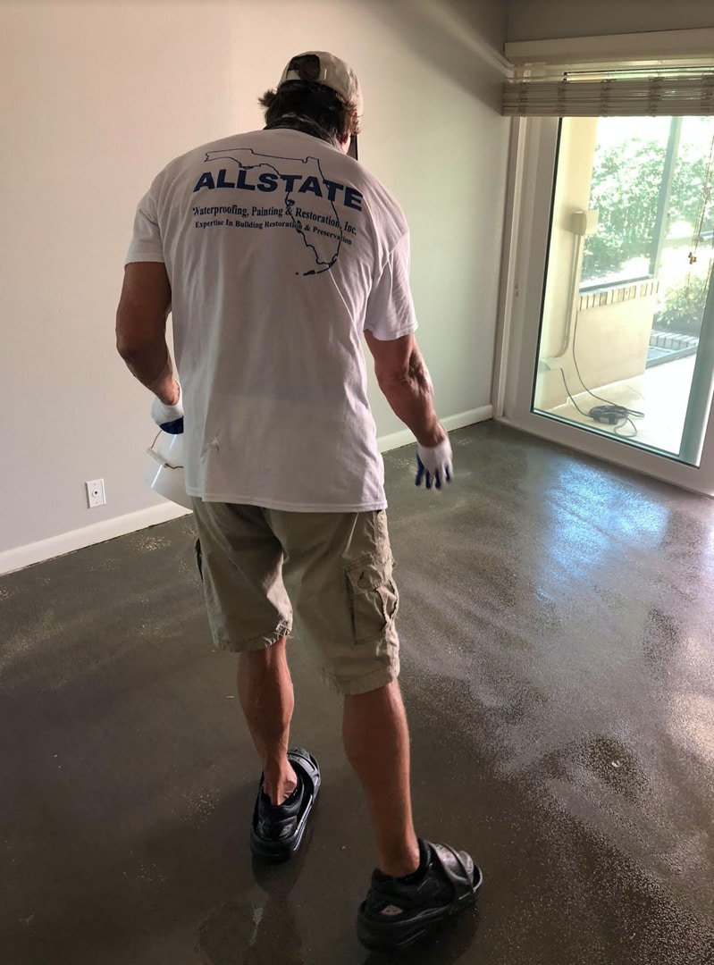 Worker Adding Texture To Waterproofing Barrier For Home In Safety Harbor Florida